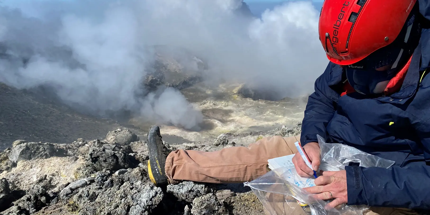 Fig 5. Rock samples collected at the summit of Mt. Etna, 2023. Here Ben de Jarnatt collects samples of hydrothermally altered rocks for further physical and chemical analysis. (GFZ)